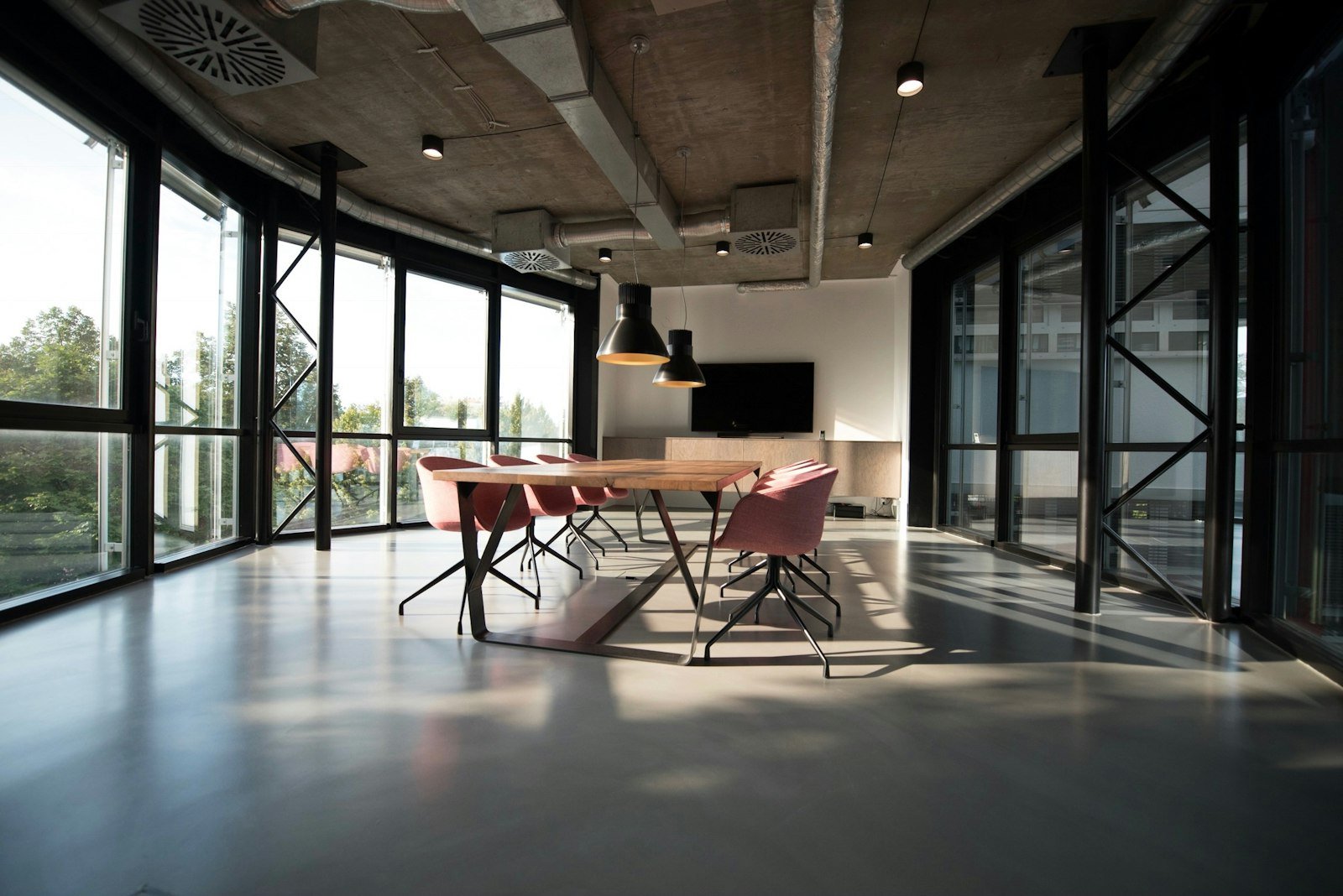 Commercial workplace corridor with glazed and solid partitions typical of a UK office fit-out.