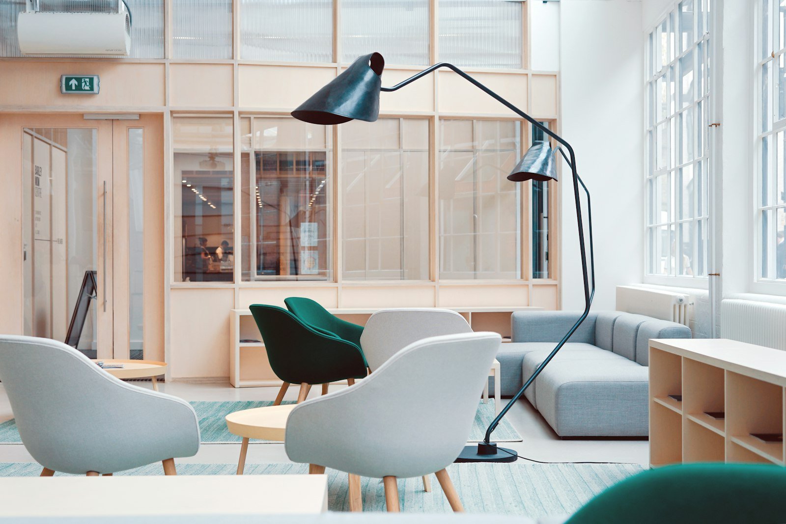 Completed commercial workplace interior with meeting rooms and open-plan desks.